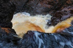 Waterfall rushing over rocks